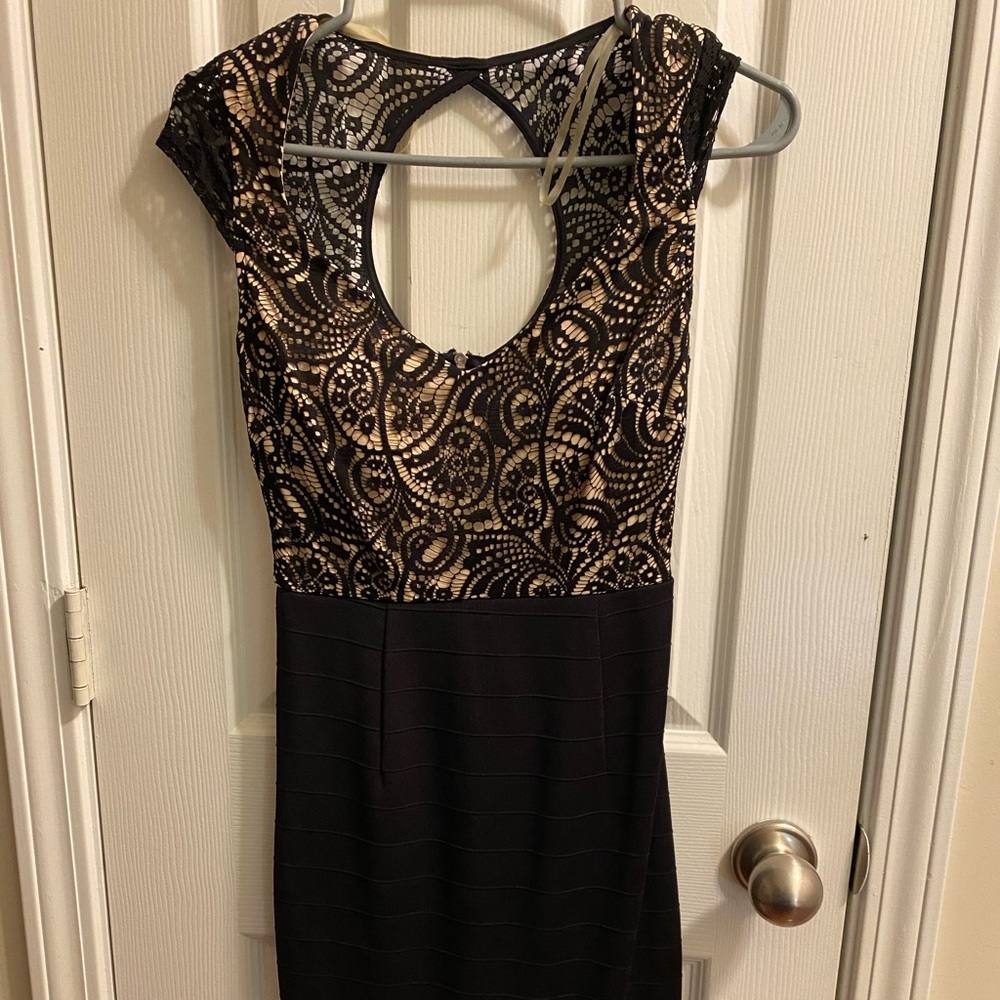 Woman’s black bodycon dress with lace overlay